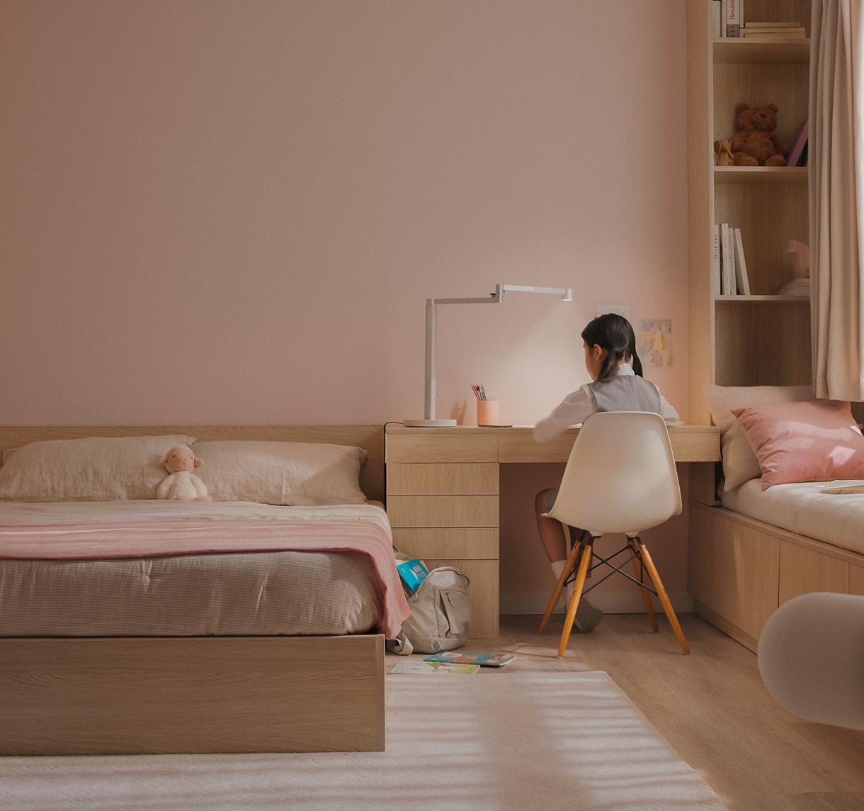 Child working efficiently using Dyson lighting.